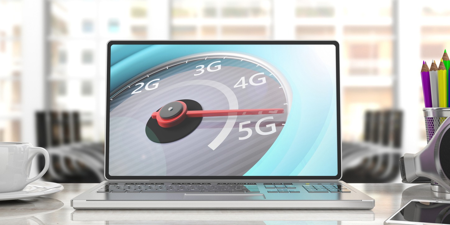 3D illustration of a computer laptop screen displaying a speedometer reaching 5G high-speed network internet connection, set against a blurred business office background.