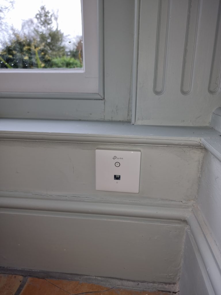 Professional installation of a WiFi access point, ensuring seamless connectivity and enhanced wireless network performance in the designated area.