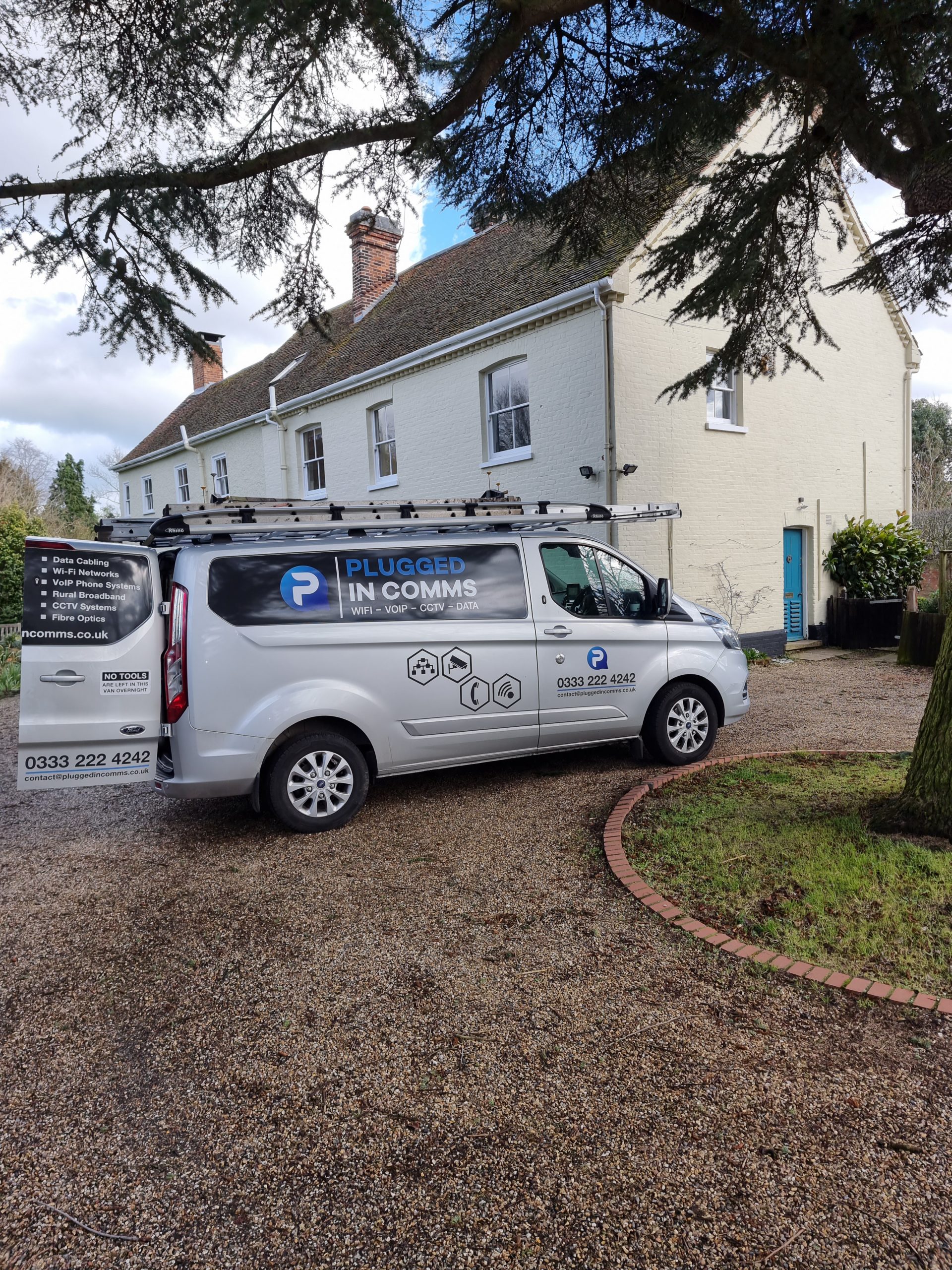 Plugged in Comms van, working in rural Essex for a large house, ensuring efficient communication solutions and connectivity in remote areas.