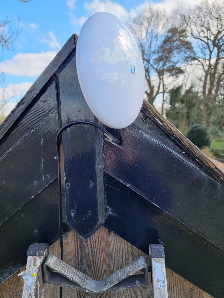 Installation of point-to-point WiFi link to outbuilding, enhancing connectivity and expanding internet access in a seamless installation process.