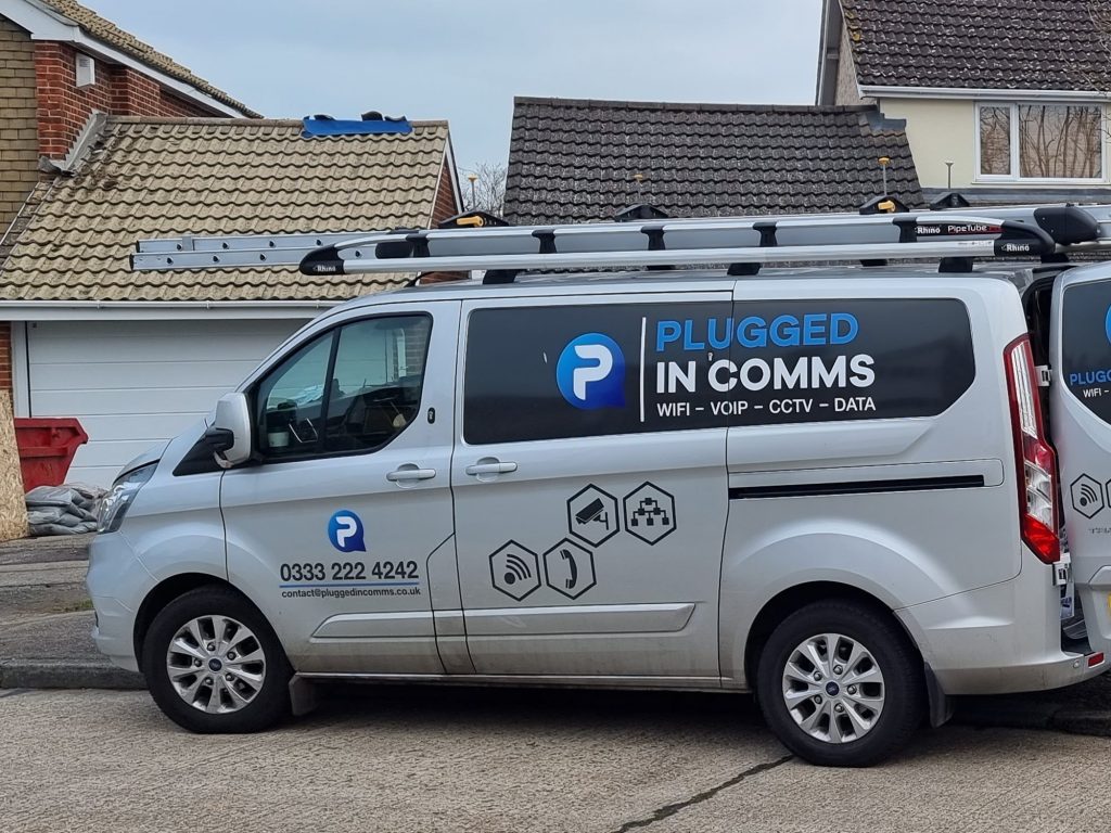 Doddinghurst Essex Engineer Comms van plugged in, actively working in Essex, ensuring reliable communication solutions and connectivity services for the local area.